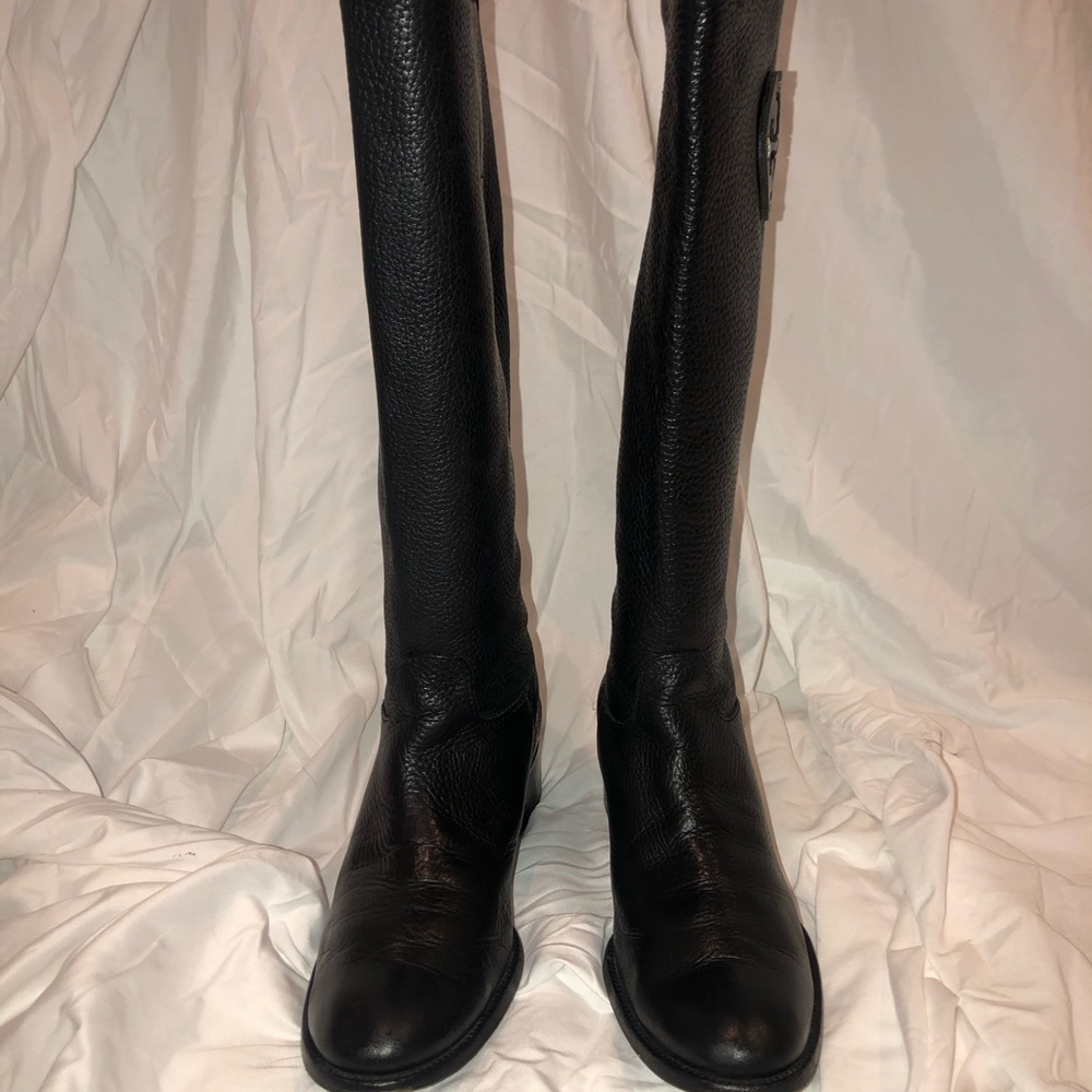 Tory Burch boots (black) with signature TB label.